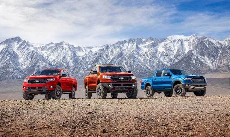 Three 2023 Ford Rangers parked in the mountains